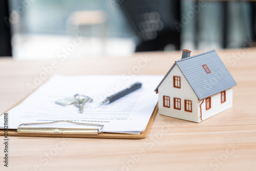 Real estate purchase agreement home office document preparation modern environment close-up view financial security