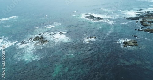 Drone shot of sea waves crashing on rocky reef The Concept of environmental power