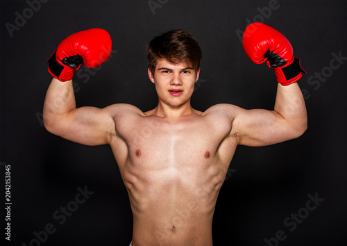 Muscular Boxer Flexing Arms.
