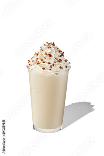 45 degree angle shot of gourmet milkshake beverage with whipped cream and nuts topping, isolated.
