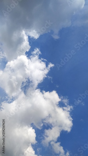 Blue sky with white clouds stock photo.