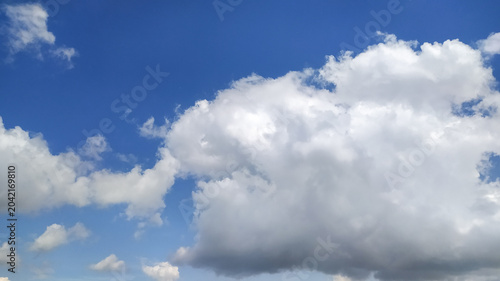 Blue sky with white clouds stock photo.