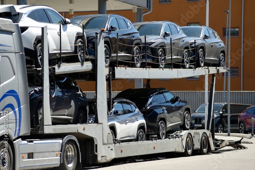Car transporter carries new vehicles