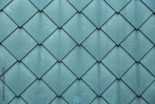 Diamond shaped fish scale tiled wall texture background