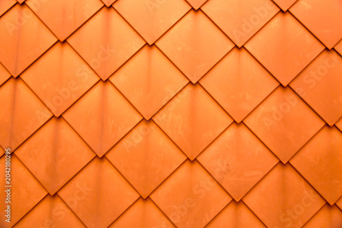 Diamond shaped fish scale tiled wall texture background