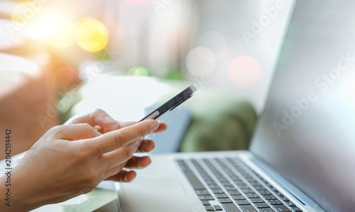 Person use smartphone and laptop used for email management,Customer communication,Online workflow,business productivity,Mobile connectivity,Digital communication,Remote work,Secure information access