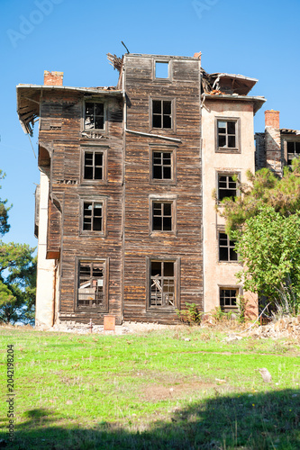 Abandoned wooden building with weathered facade showing decay and forgotten charm