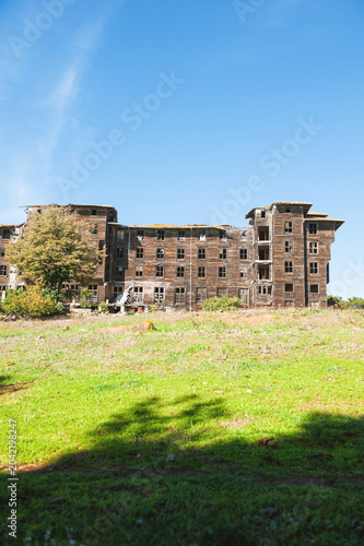 Abandoned wooden building with weathered facade showing decay and forgotten charm