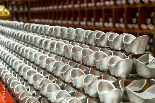 Tableau sur toile Rows of Traditional Chinese Silver Ingots Arranged Neatly