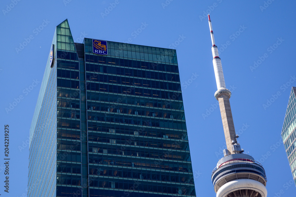 Naklejka premium Toronto, Ontario, Canada - June 19, 2018: Royal Bank of Canada (RBC) office in RBC Centre on Wellington St W with CN Tower in the background in downtown Toronto, Ontario, Canada.