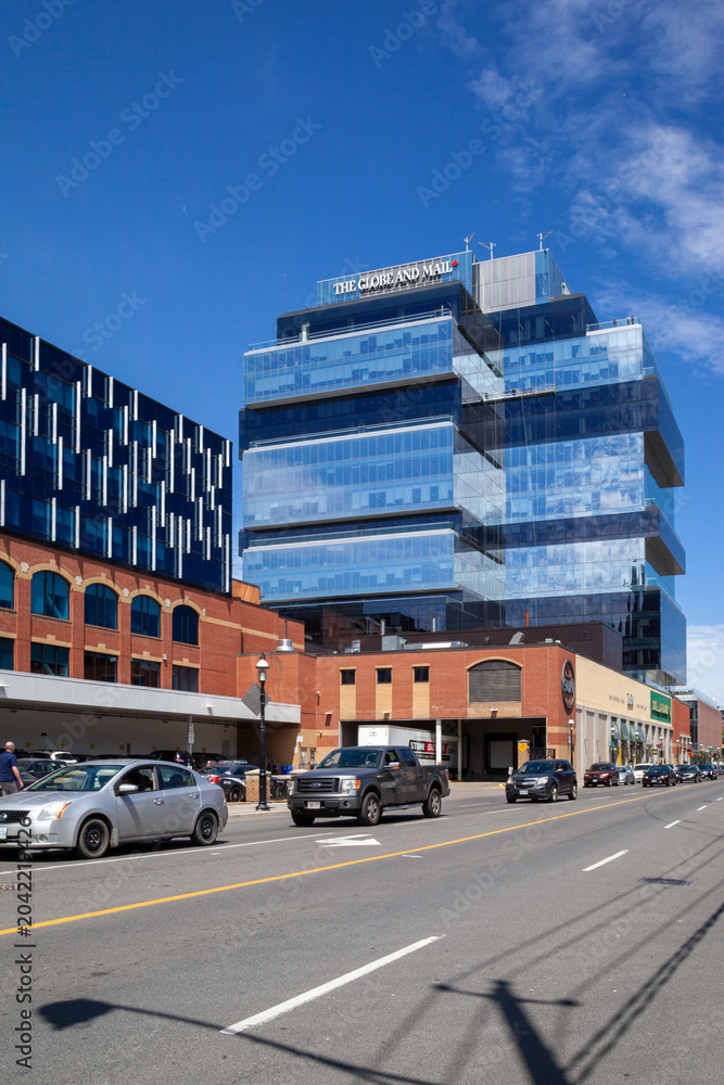 Obraz premium Toronto, Canada - June 19, 2018: Globe and Mail on the Headquarters office building in Toronto. The Globe and Mail is a Canadian newspaper printed in five cities in western and central Canada