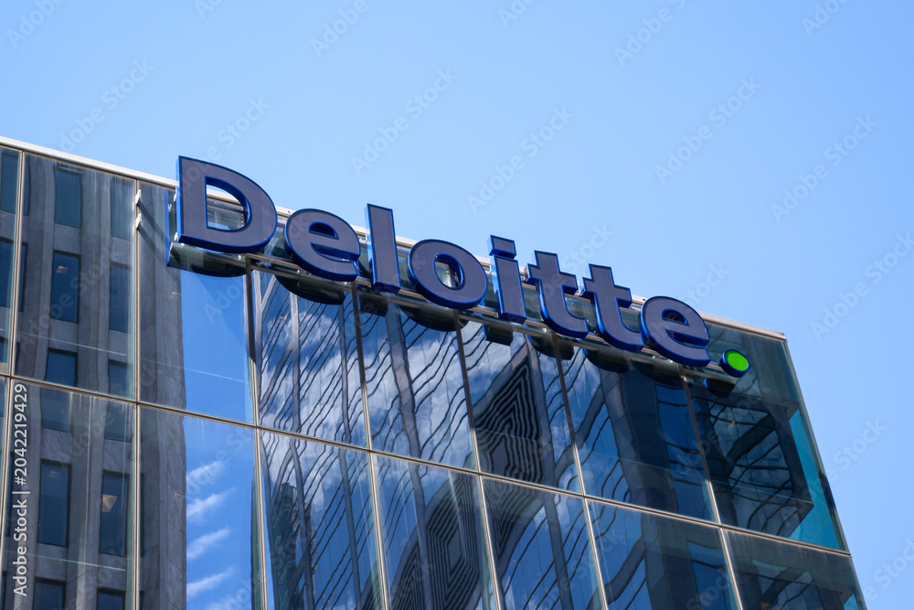 Naklejka premium Toronto, Ontario, Canada - June 19, 2018: Closeup of Deloitte sign on the building in Toronto, Ontario, Canada. Deloitte is a British multinational professional services network. 