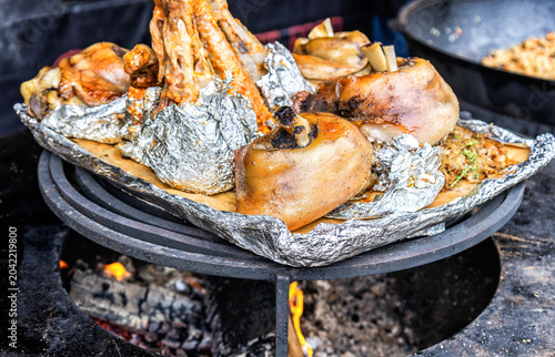 Baked and grilled meat cooked on the grill over the hot coals