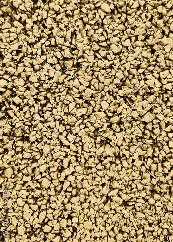 Fotografie Macro texture of yellow rubber safety surfacing, close-up playground granulate f