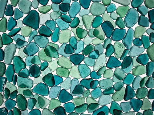 Blue and Green Frosted Sea Glass Background Texture with Assorted Tumbled Glass Pieces
