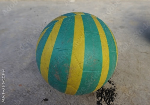 plastic ball, Green and yellow patterned plastic balls on the cement floor, children's toys