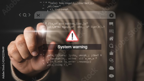 Close up of finger touching system warning alert on screen with code.