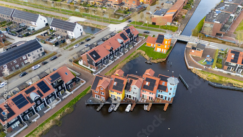 Drone aerial view of reitdiephaven groningen colorfull houses at the water