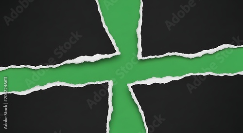 Torn black paper reveals vibrant green background in a cross shape