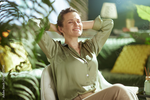 Peaceful Woman Relaxing in Sunlit Home Office