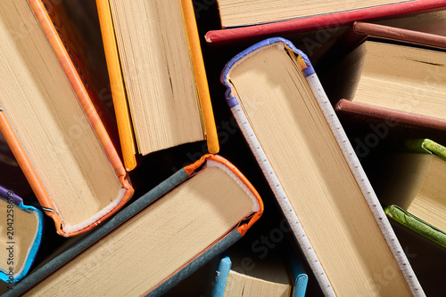 Literature books stacked on a library.