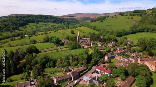 Aerial panoramic view of St Michael and All Angels Church and Hathersage landscape