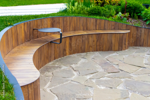 Modern wooden park benches. Landscape design.