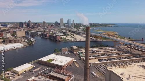 flying past smokestack towards downtown Milwaukee