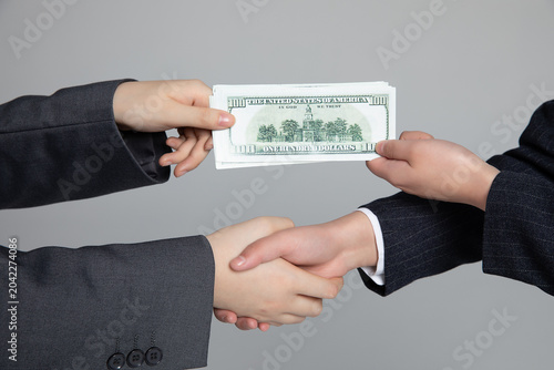 Canvastavla Handshake with cash exchange symbolizing bribery and business corruption