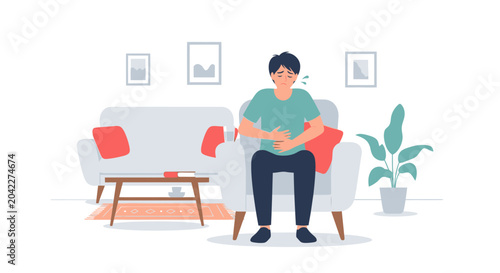 Man Experiencing Stomach Pain While Sitting in a Modern And Comfortable Living Area