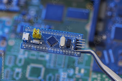 Obraz na płótnie Microcontroller development board over electronic circuit boards