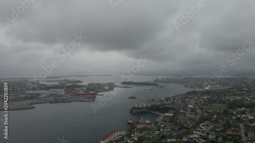 This high-quality aerial drone footage captures a quiet residential neighborhood on the outskirts of Stavanger, Norway. Filmed during the midday hours under a soft, overcast sky.