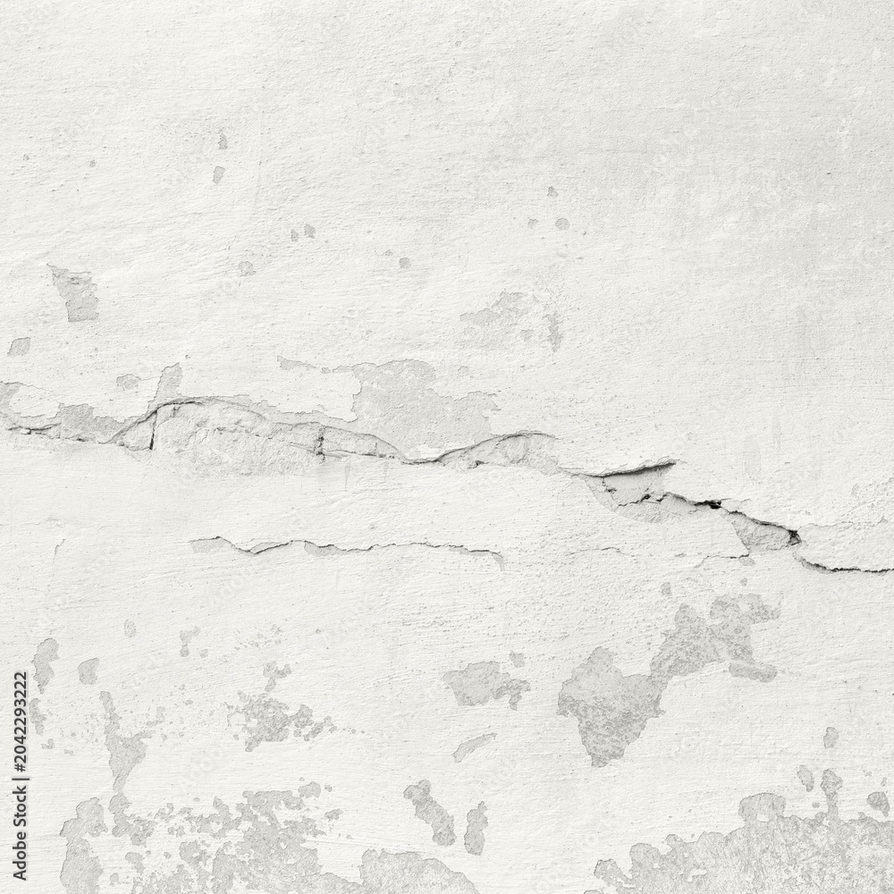 Fototapeta premium Cracked plaster wall with peeling paint and weathered texture on old exterior surface