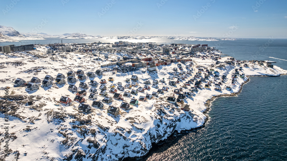 Schilderij op canvas Winter aerial cityscape of Greenlandic capital Nuuk with coastal housing, rocky