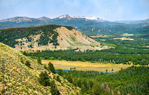 Photos A sweeping view of forested valleys and rolling hills seen from the slopes of Signal Mountain in Grand Teton National Park, Wyoming