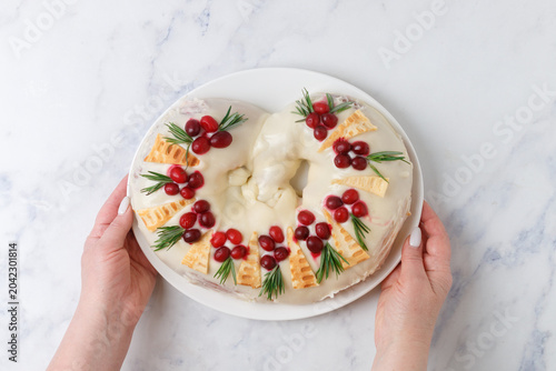 Pie with marzipan, cranberries and rosemary. A pretzel. Selective focus