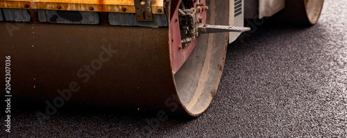 Schilderij op canvas Urban Asphalt Paving Work on a Street Road During Daytime Construction Activitie