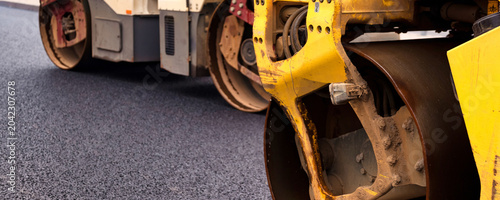 Bild auf Leinwand Asphalt Paving Work in Urban Area Focuses on Improving Streets and Roads