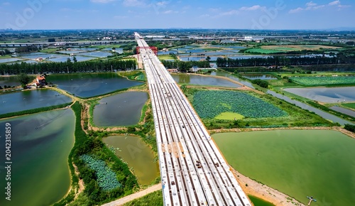 High-Speed Rail Bridge Crossing Wetland and Agricultural Landscape, China