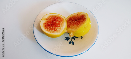 Isolated fig. Fresh organic fig isolated crop path. Fig macro studio photograph.