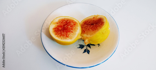 Isolated fig. Fresh organic fig isolated crop path. Fig macro studio photograph.