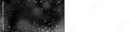 Fotografie White snow dust particles on black and transparent split background showing realistic winter blizzard effect
