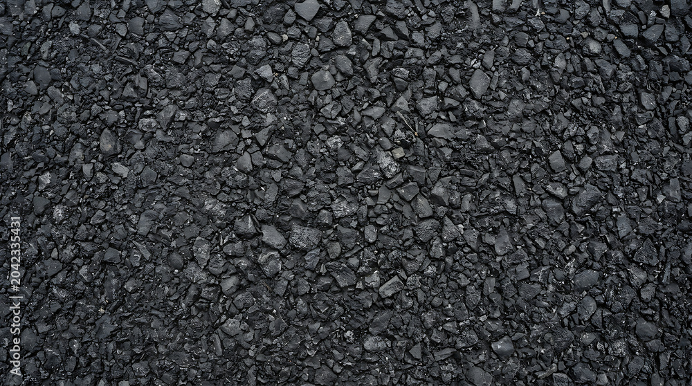 Fototapeta premium Seamless dark black asphalt texture background with crushed stones and bitumen surface for road construction industrial pavement and infrastructure