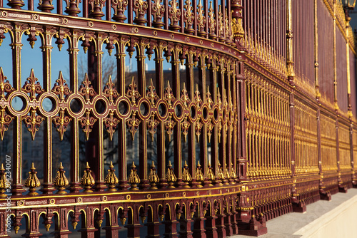 Bild auf Leinwand Decorative red and gold iron fence in Vienna, Austria