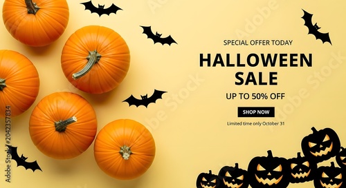 Halloween sale banner with pumpkins and bats on yellow background