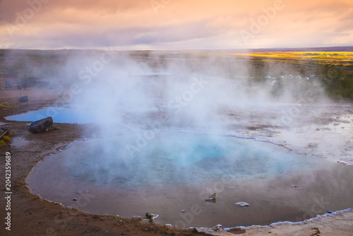 Blesi geyser at rest during sunset in southwestern Iceland