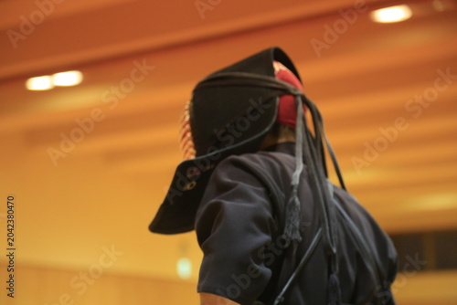 Schilderij op canvas Martial artist stands in quiet readiness