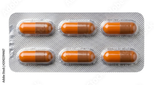 Orange and brown pharmaceutical capsules in a silver blister pack on a transparent background PNG file