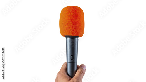 Hand holding orange microphone with foam pop filter, isolated on transparent background