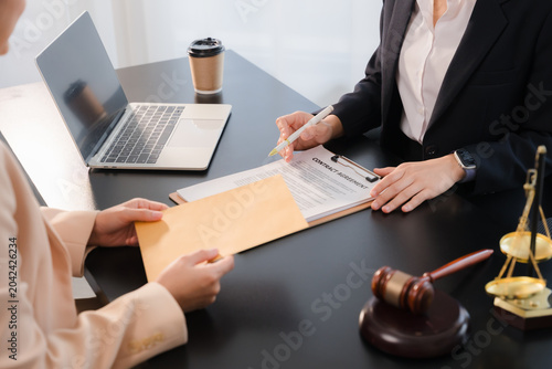 Fotografie Justice lawyer meeting with contract papers and Judge gavel on tabel in courtroom